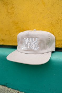 Thrill Seekers Coaster Cap Bone Cream Flat Brim Adjustable Baseball Cap, Cream Casual Hat With Flat Bill, Casual Cream Flat Bill Hat, Cream Snapback Hat With Flat Brim, Cream Flat Brim Baseball Cap One Size, Cream Flat Brim Baseball Cap, Cream Snapback Baseball Cap, Casual Curved Brim Baseball Cap For Skateboarding, Casual Flat Brim Hat For Skateboarding