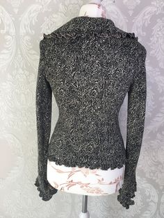 "Vtg black and white colors knitwear handmade women jacket/cardigan with pink textile lining. The sleeves ends, collar and bottom with ruffles. Summer retro large collar granny romantic elegant clothes. Small size S. European 80s fashion. No labeled size, approx.size S or M. US size 6. condition: great vintage. No spots or damages. measurements in lying flat: length 55 cm / 21.5\" in armpit to armpit 44 cm / 17.2\" in shoulders: 41 cm / 16'' in sleeves length from shoulder line: 67 cm / 26.1\" i Elegant Turtleneck Cardigan For Spring, Elegant Spring Turtleneck Cardigan, Elegant Fitted Turtleneck Cardigan, Spring Fitted Ruffle Cardigan, Fitted Ruffle Cardigan For Spring, Fitted Long Sleeve Ruffle Cardigan, Elegant Ruffled Sweater For Fall, Elegant Long Sleeve Sweater With Ruffles, Fitted Turtleneck Cardigan For Fall