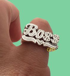 Boss Name ring in Gold, Silver or Two tone style is a perfect statement ring for you.  **COLOR** Gold and Rhodium overlay.( Silver accent, first letter) Rose over silver. Plain silver. 10k gold 14k gold **SIZES** From 3/4'' to 1 '' depends on the name. Name size is going to be adjusted accordingly by a ring size. I am able to do men sizes from US 7 to 13. Large size is $12 more.(Over size 14-15). HOW IS THE RING MADE? We use sterling silver .925 to create our beautiful rings for you. All our cus Silver Nameplate Rings For Anniversary, Custom Name White Promise Ring, Custom Name White Gold Round Ring, Custom Name White Gold Ring, White Gold Custom Name Ring, Custom Name Nameplate Ring For Promise, Custom Nameplate Rings For Promise, Custom Nameplate Ring For Promise, Custom Name Silver Rings