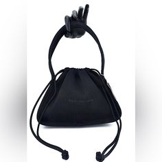 Black Small Dust-Bag Purse With Drawstring Top Closure And Printed Logo Across Front In Ribbed Nylon Measurement: 25 X 19 X 8 Cm Fixed Length Handle One Main Compartment Composition: 87%Polyester / 13%Nylon Used Once No Stains No Tears Or Smells Like New Condition Black Double Handle Bucket Bag For Evening, Evening Black Bucket Bag With Detachable Handle, Elegant Top Handle Nylon Bags, Elegant Nylon Shoulder Bag For Shopping, Evening Nylon Bag With Removable Pouch, Chic Evening Bag Made Of Nylon, Elegant Nylon Top Handle Bags, Elegant Nylon Shoulder Bag For Evening, Elegant Evening Nylon Bag