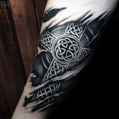 a black and white tattoo on the arm of a person with a cross in it