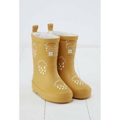 a pair of yellow rain boots with clouds on them