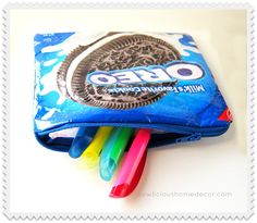 an oreo bag filled with markers and pencils on top of a white table