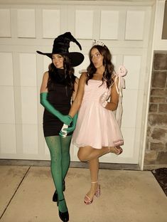 two women dressed up in halloween costumes posing for the camera