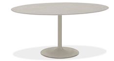 a white table with an oval top on a white background and the base is made out of concrete