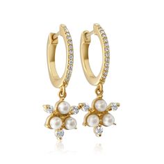 This Gold Diamond Pearl Cluster Drop Hoop Earring features gold set in 14k Yellow Gold. Gold 2.01 Grams Diamond 0.19 cts Pearl 0.56 cts Sold as a pair Luxury Yellow Gold Drop Cluster Earrings, Pearl Cluster, Gold Set, Gold Gold, Pearl Drop, Gold Style, Yellow Color, Gold Diamond, Solid Gold