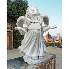 a statue of an angel holding two hands