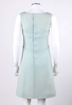 For Sale on 1stDibs - Vintage Courreges Hyperbole c.1970's sky blue wool sleeveless signature logo A-line dress. Numbered: '083360'. Designed by Andre Courreges. Sky blue wool Fitted Vintage A-line Sleeveless Dress, Sleeveless Blue Dress For Vintage Fashion, Mod Sleeveless Dresses With Buttons, Blue Fitted Sleeveless Dress For Daywear, Light Blue Sleeveless Vintage Dress, Light Blue Sleeveless Dress With Buttons, Fitted Sleeveless Mid-century Dress, Vintage Fitted A-line Sleeveless Dress, Sleeveless Mod Dresses For Daywear