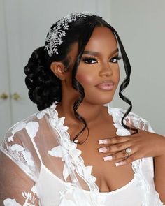 a woman with long hair wearing a white dress and holding her hands on her chest