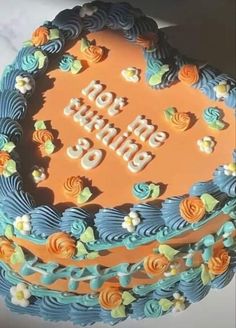 a birthday cake with blue and orange frosting that says, not turning 30 on it