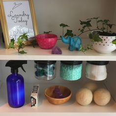 the shelves are filled with vases, bowls and other things to decorate in their home