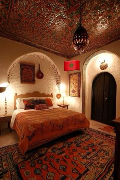 a bed room with a neatly made bed and rugs