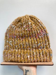 Warm up with this chunky cozy hand knit beanie. Beautiful golden yellow tweed with hints of color.  one size fits all, will stretch accordingly.  wool blend Handmade Yellow Crochet Hat For Winter, Yellow Crochet Hat For Winter, One Size, Winter Yellow Crochet Hat, One Size, Winter Yellow Crochet Hat, Yellow Hand Knitted Beanie Crochet Hat, Yellow Knit Beanie Hat, Yellow Yarn Crochet Beanie Hat, Hand Knitted Yellow Crochet Hat One Size, Hand Knitted Yellow Crochet Hat