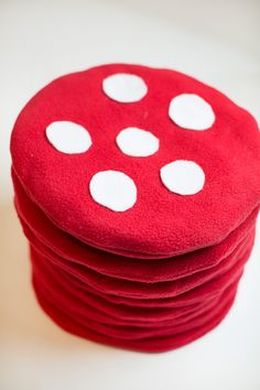 red and white polka dot coasters stacked on top of each other