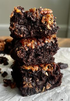 three chocolate brownies stacked on top of each other