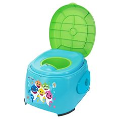 the children's potty is blue with green lid and fish design on it