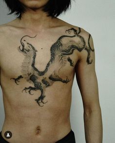 a man with a dragon tattoo on his chest