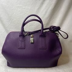 Gold Tone Hardware, Zippers Are Working, Comes With Shoulder Strap, Clean Inside, 7.5 Inches Tall, 13 Inches Long, 6 Inches Wide, Euc 4 Inch To 17 Inch Drop Chic Purple Bag With Silver-tone Hardware, Elegant Purple Shoulder Bag With Palladium Hardware, Chic Purple Satchel For Formal Occasions, Elegant Purple Satchel With Adjustable Strap, Elegant Purple Bag With Zipper Closure, Elegant Purple Bags With Zipper Closure, Elegant Purple Shoulder Bag With Zipper, Purple Shoulder Bag, Furla Bags