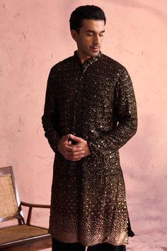 SHRESTHA By VASTRAMAY Men's Black Georgette Zari With Sequins Worked Kurta Patiala Set Discover elegance and style with the SHRESTHA By VASTRAMAY Men's Black Georgette Kurta Patiala Set. Adorned with intricate Zari and sequins work, this ensemble is perfect for festive occasions, offering a blend of tradition and contemporary fashion. Features Stylish black Georgette fabric Intricate Zari with sequins work Comfortable Patiala pants Perfect for festive and special occasions Specifications Brand: VASTRAMAY Color: Black Size: Available in multiple sizes Type: Kurta Patiala Set Material & Care Material: Georgette Care: Dry clean only Store in a cool, dry place Legal Disclaimer: The product is guaranteed to be 100% genuine. Product images are for illustrative purposes only. Images/packaging/ la Festive Black Sequined Kurta, Fitted Sequin Kurta For Festivals, Fitted Black Kurta For Party, Black Sequined Wedding Kurta, Black Fitted Kurta For Winter, Black Long Sleeve Kurta For Transitional Season, Winter Black Fitted Kurta, Traditional Black Sets With Sequins, Traditional Black Sequined Sets