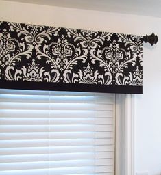 a black and white valance hanging over a window