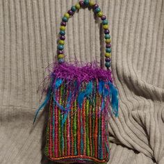 Perfect Size To Carry Your Phone, Cards A Lipstick And Compact. This Cute Boho Style Bag Features A Multi Color Woven Silk Exterior With An Aqua Satin Lining. The Hand Beaded Handle Features Wooden And Glass Beads And Is Trimmed With Eyelash Trim, Feathers And Glass Beads. One Of A Kind Piece. Smoke Free Home Multicolor Bucket Bag For Party, Multicolor Party Gift Bag, Multicolor Handheld Gift Bag, Multicolor Party Bag, Multicolor Party Bags With Handles, Multicolor Party Bags, Chanel Mini Bag, Linen Handbags, Boho Style Bag