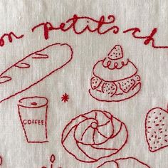 a white towel with red writing on it that says donuts, coffee, and doughnuts