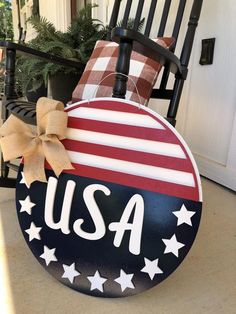 a rocking chair decorated with an american flag and the word usa painted on it's side