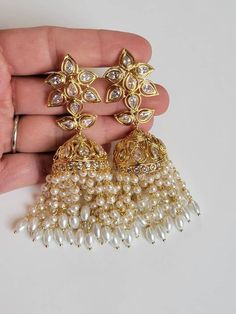 Beautiful high end quality. Light weight for comfort wear. Gold plating for lasting shine. NUST HAVE PIECE! Elegant Pearl Earrings With Stone Work For Wedding, Kundan Bridal Earrings With Pearl Drop For Wedding, Elegant Tilla Pearl Earrings For Wedding, Elegant Jhumkas For Wedding And Festivals, Festive Bridal Pearl Drop Earrings For Wedding, Festive Wedding Pearl Drop Bridal Earrings, White Chandbali Pearl Earrings For Wedding, Elegant Kundan Bridal Earrings, Pearl Earrings With Stone Work For Wedding