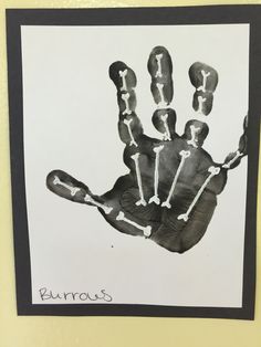 a black and white drawing of a hand with bones on it