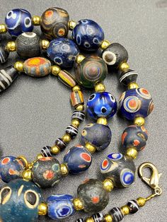 A beautiful multi color glass beads necklace from Ancient Romans time from Afghanistan some gold color brass beads are used as spacers in the necklace we provide fast and free shipping to our customers by which can get the items by 7 maximum working days Glass Beads Necklace, Ancient Roman Glass, Beaded Jewelry Necklaces, Asian Countries, Glass Beads Jewelry, Brass Beads, Roman Glass, Jasper Necklace, Carnelian Beads