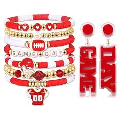 a set of red and white bracelets, earrings and earring with the word game day written on it