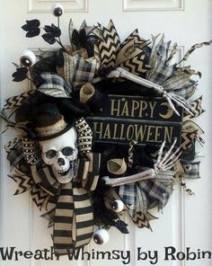 a wreath decorated with black and white decorations