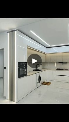 an empty kitchen with white cabinets and appliances