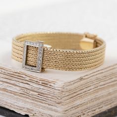 We love a jewel that is both beautiful and functional! We love how this mesh bracelet appears like any other bracelet out there but a quick flip of the lid opens to reveal a slender watch underneath. Chic, elegant, and a perfect addition to any jewelry wardrobe. 14kt yellow gold, 6.7” in length, 24.9 pennyweights.Diamonds are estimated H/I colors, VS clarities, GIA standards.Please see qualitative report for more information. Luxury Jubilee Bracelet Jewelry For Wedding, Luxury Jubilee Bracelet For Wedding, Luxury Wedding Jewelry And Watches With Jubilee Bracelet, Luxury Jubilee Bracelet Jewelry For Evening, Elegant Yellow Gold Bracelet With Diamond Hour Markers, Elegant Rectangular Bracelet Strap Jewelry, Elegant Evening Diamond Watch With Bracelet Strap, Elegant Rectangular Diamond Watch With Bracelet Strap, Elegant Diamond Watch With Bracelet Strap