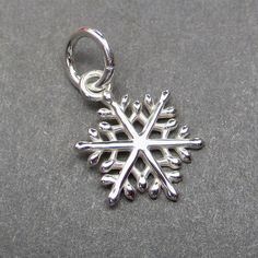 Medium sterling silver snowflake with 6mm open sterling silver jump ring.  Finished dangle measures 17mm x 10mm (25mm = 1 inch).   This listing is for 1 charm.  LARGE VERSION HERE: https://www.etsy.com/listing/1108475124/large-sterling-silver-snowflake-necklace MORE Charms, Dangles and Pendants: http://www.thedanglediva.etsy.com FOLLOW me: www.facebook.com/thedanglediva for new designs and discount coupons INTERCHANGEABLE EARRINGS: https://www.etsy.com/shop/TheDangleDiva?ref=hdr_shop_menu§ion_id Sterling Silver Snowflake Jewelry, Silver Snowflake Jewelry For Christmas, Silver Sterling Snowflake Jewelry, Silver Snowflake Sterling Silver Jewelry, Nickel-free Snowflake Jewelry For Gift, Interchangeable Earrings, Snowflake Necklace, Chocolate Gift Boxes, Silver Snowflakes