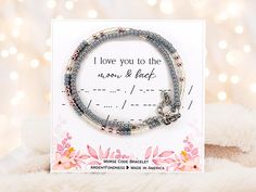 a card with two bracelets on it and the words i love you to the moon and back