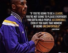 a man holding a basketball in his right hand with an inspirational quote on the side