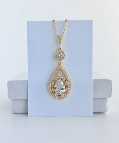 Super sparkly clear cubic zirconia bridal tear drop earrings in gold plated brass setting. I've created these truly amazing earrings with delicately detailed clear cubic zirconia teardrop that dangles from a cubic zirconia detailed halo connector and teardrop ear stud. Total length of the earrings is 5.4 cms. For matching necklace click: https://www.etsy.com/listing/544576302/gold-bridal-necklace-gold-crystal?ref=shop_home_active_1 To browse my collection click : https://www.etsy.com/shops/fanta Bridesmaid Jewelry Gold, Bridal Necklace Gold, Gold Wedding Earrings, Gold Bridesmaid Jewelry, Rose Gold Earrings Wedding, Rose Gold Bridal Jewelry, Gold Teardrop Earrings, Amazing Earrings, Teardrop Earrings Gold