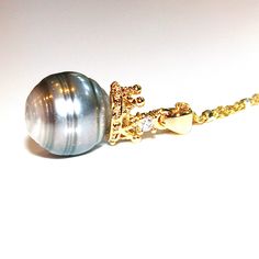 "This is a gorgeous natural striped grey baroque Tahitian pearl pendant necklace has a tiny gold plated tiara with a cubic zirconia. The pearl drop is suspended from a 18\" gold vermeil chain with silver squares. Tres chic! xoxoxo payton For more cool jewelry looks, check out http://www.etsy.com/shop/FizzCandy All FizzCandy creations come beautifully boxed and ready for gift giving." Gray Pearl Necklace, Tiara Necklace, Jewelry Princess, Tahitian Pearl Pendant, Grey Pearl Necklace, Tahitian Pearl Necklace, Princess Necklace, Crown Necklace, Necklace Pearl