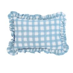 a blue and white checkered pillow with ruffled edges