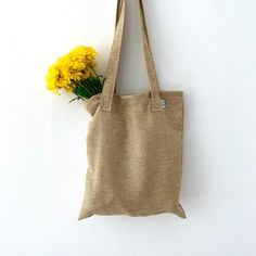 The perfect everyday tote! Great for use as a purse, produce bag, beach bag, and much more! Handmade out of recycled fabric in small batches. Shipped in a biodegradable envelope  - handmade! - dimensions: 16inx14in - handle length: 17in - Machine wash cold, hang dry - NOTE: may not appear exactly as pictured due to different cuts of fabric  - NOTE: once a pattern is sold out it is gone for good! Beige Recyclable Shoulder Bag For Everyday Use, Eco-friendly Recyclable Shoulder Bag, Organic Everyday Reusable Canvas Bag, Beige Recyclable Tote Shoulder Bag, Eco-friendly Recyclable Tote Shoulder Bag, Eco-friendly Recycled Material Shoulder Bag For Daily Use, Eco-friendly Daily Use Shoulder Bag With Recycled Materials, Eco-friendly Everyday Reusable Canvas Bag, Everyday Natural Bag Made Of Recycled Materials