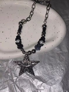 𝔇𝔢𝔱𝔞𝔦𝔩𝔰: Style: Punk, Goth, Alternative, Darkwear, Material: Alloy Metal The wearer of this punk necklace is taking a stand for meteorite fashion. The star pendant beads embrace trends while remaining timeless, crafted from durable metal with a cool, cratered texture inspired by the cosmos. Solid material, high-quality necklace Enjoy free shipping with a purchase of over 80$ Edgy Adjustable Star-shaped Jewelry, Adjustable Edgy Star Jewelry, Edgy Silver Star-shaped Jewelry, Adjustable Edgy Star-shaped Jewelry, Adjustable Star-shaped Edgy Jewelry, Edgy Silver Beaded Jewelry, Emo Metal Necklace For Festivals, Silver Emo Style Necklace For Festivals, Silver Emo Necklace For Festival