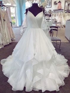 Silhouette:?Ball Gown Waist: Natural Sleeve Length: Sleeveless Shown Color:?White Built-In Bra: Yes White Tulle Wedding Dress, Wedding Dresses V Neck, White Prom, Dresses V Neck, Ruffle Wedding Dress, Pnina Tornai, Long Prom Gowns, White Prom Dress, White Tulle