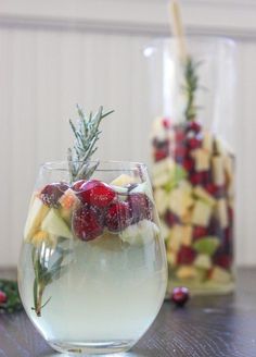 two wine glasses filled with fruit and veggies