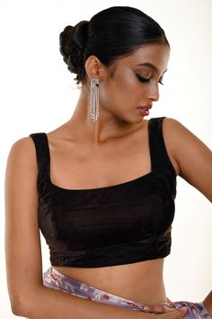 Look stunning in the Dark Brown Velvet Sleeveless Blouse. Its rich hue and soft fabric make it stand out, while the square neckline adds comfort and style. This blouse exudes luxury and sophistication, perfect for special occasions or elevating your daily outfits. Brown Velvet Blouse, Velvet Sleeveless Blouse, Square Neckline Blouse, Modern Blouse, Baluchari Saree, Orange Lehenga, Golden Blouse, Saree Blouse Styles, Silver Blouse