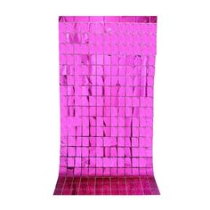 a pink wall that has some squares on it