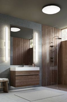 a modern bathroom with wooden walls and flooring