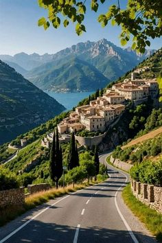 the road is winding with houses on both sides