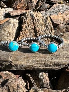 A Kingman Turquoise round 8mm stone is set in a sterling silver bezel. The setting is soldered on a sterling silver beaded wire band that is smoothed flat. The rings pictured are size 4 1/2, 5 1/2, 8 1/4. Other sizes can be made to order. Message me if you want another size. Bohemian Adjustable Stackable Turquoise Ring, Adjustable Stackable Bohemian Turquoise Ring, Adjustable Southwestern Turquoise Ring Nickel-free, Adjustable Southwestern Turquoise Ring Nickel Free, Adjustable Southwestern Style Turquoise Ring Nickel Free, Bohemian Adjustable Rings With Round Stone, Adjustable Stackable Turquoise Ring, Stackable Sterling Silver Turquoise Ring, Bohemian Adjustable Turquoise Stackable Rings