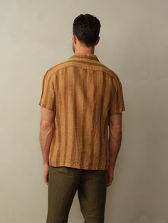 Camp collar shirt in embroidered French linen. Garment washed for an extra soft hand. Fit: Model is wearing size M. Fits true to size. Bowling collar with a straight hem. Material: 100% European Flax. Coconut shell buttons. Care: Machine wash cold with like color. Tumble dry low. Do not bleach. Cool ironing. Origin: Made in Portugal. Vintage Linen Shirt With Relaxed Fit, Brown Shirt With Placket In Relaxed Fit, Brown Relaxed Fit Shirt With Placket, Casual Embroidered Linen Tops, Traditional Fit Cotton Summer Tops, Traditional Fit Cotton Tops For Summer, Traditional Tops With Relaxed Fit And Camp Collar, Classic Embroidered Summer Shirt, Vintage Linen Tops With Relaxed Fit